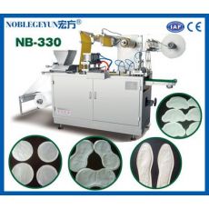 NB-330型暖寶寶包裝機，全自動發(fā)熱貼生產(chǎn)設(shè)備