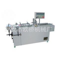 半自動(dòng)透明膜三維包裝機(jī)、煙條、香煙、化妝品包裝 安全套包裝機(jī)